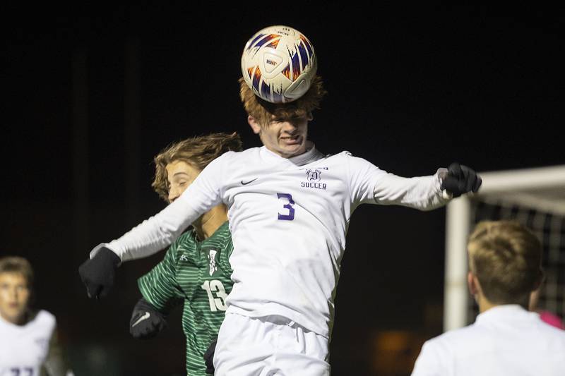 Dixon’s Dylan Osmer heads the ball against Geneseo Wednesday, Oct. 23, 2024, during the class 2A soccer regional in Geneseo.