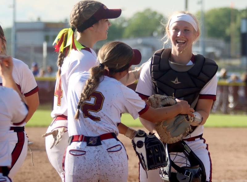 Richmond-Burton’s catcher Taylor Davison, right, is greeted at the dugout late in the Rockets’ win over Stillman Valley in softball sectional title game action in Richmond Friday evening.