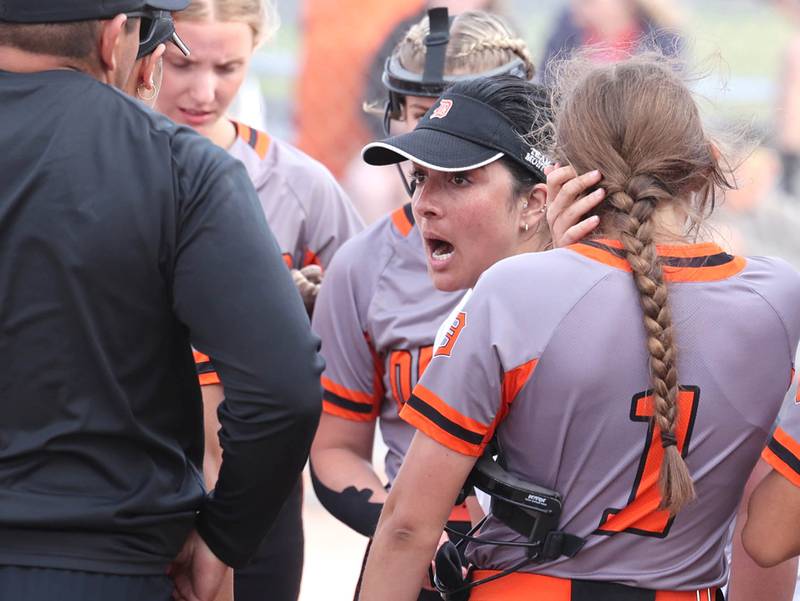 Dekalb's head coach Haley Albamonte gets her team fired up between innings of their Class 4A regional game against Auburn Wednesday, May 24, 2023, at DeKalb High School.