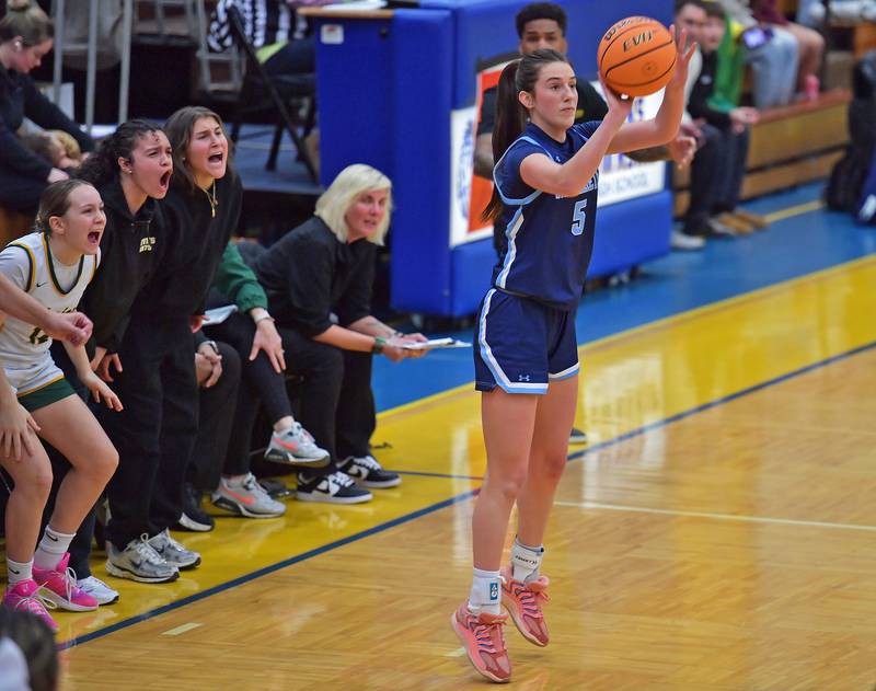 Nazareth’s Sophia Towne (5) shoots and scores three points as the Waubonsie Valley bench tries to distract her during the Class 4A Lyons Supersectional game on March 2, 2026 at Lyons Township High School in LaGrange.