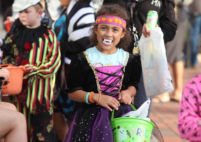 A costumed visitor shows off her scary teeth during the DeKalb Chamber of Commerce’s annual Spooktacular Tuesday, Oct. 29, 2024, in downtown DeKalb.