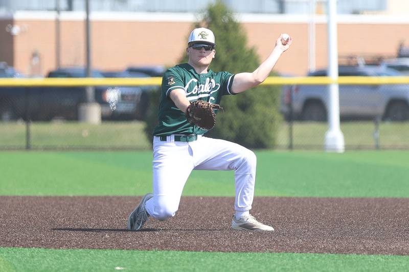 Coal City’s Ethan Olson makes a throw froths knees for the out at first base against Wilmington on Monday, March 30, 2026 in Coal City.