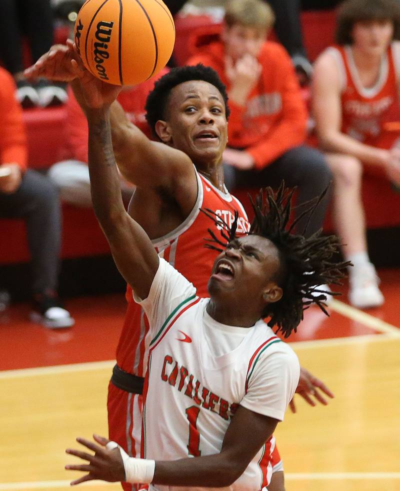 L-P's Cordell Wheatley runs in for a layup as Streaotr's Tristen Finley defends during the Dean Riley Shootin' The Rock Thanksgiving Tournament on Monday, Nov. 25, 2024 in Kingman Gym at Ottawa High School.
