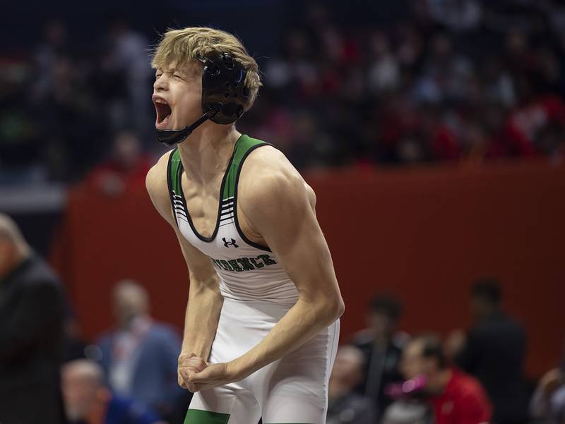 Providence Catholic’s Max Mandac screams after winning the 2A 126 pound title Saturday, Feb. 21, 2026, at the IHSA wrestling finals in Champaign.