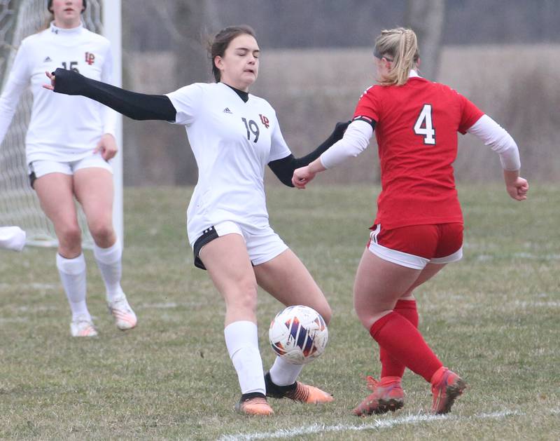 L-P's Abigal Poole stops a kick from Streator's Josie Goerne on Friday, March 24, 2023 in Streator.