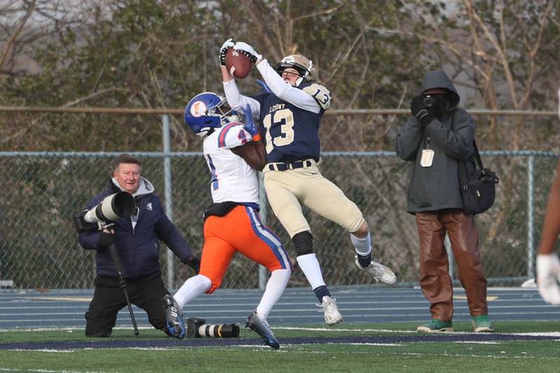Lemont’s Dylan Swanstrom intercepts a pass against East St. Louis in the Class 6A semifinal in Lemont on Saturday.
