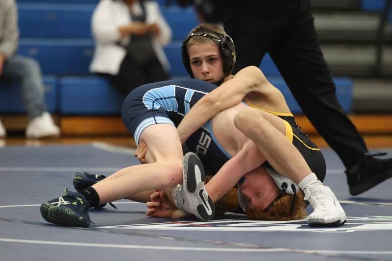 Joliet West’s Nicholas Murdock wraps up Plainfield South’s Drew Ritchie in the 106-pound match on Wednesday, Dec. 11, 2024 in Plainfield.