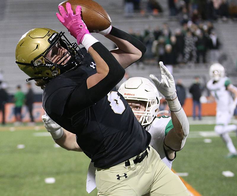 Sacred Heart-Griffin's Maddixx Morris (6) makes a catch over Providence Catholic's Caden Baudek (23) in the Class 4A state title game on Friday, Nov. 25, 2022 at Memorial Stadium in Champaign.