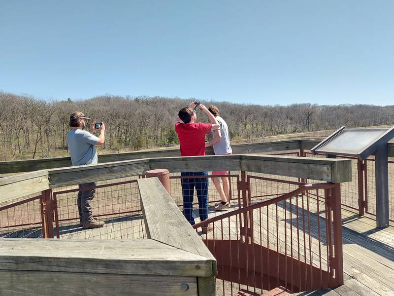 Residents viewed the partial solar eclipse Monday, April 8, 2024, from the top of the tower at the Dixon Waterfowl Refuge outside of Hennepin.