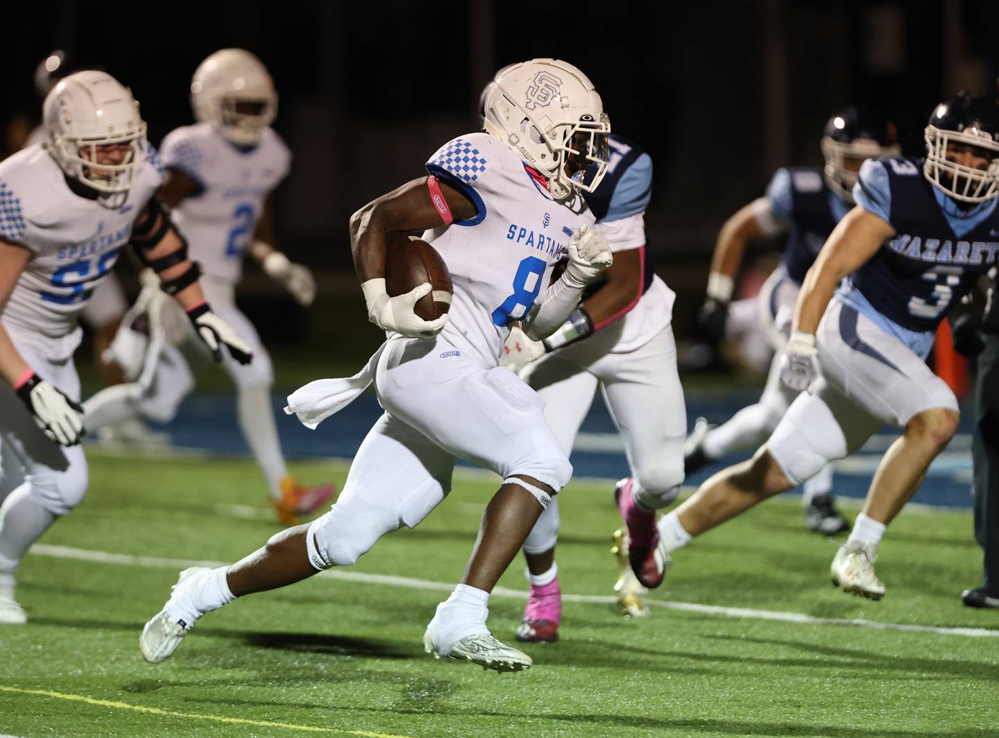 St. Francis’ TyVonn Ransom (8) runs for a touchdown against Nazareth during the boys varsity football game on Friday, Oct. 20, 2023 in La Grange Park, IL.