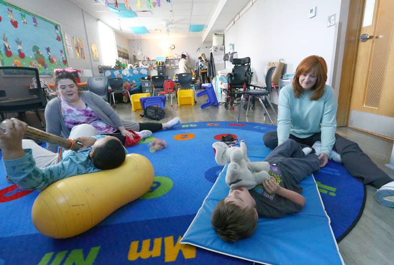 Teachers Stephanie Skul and Rachel Corsale interact with students in the preschool and kindergarten room on Wednesday, April 20, 2022 at Lighted Way in La Salle.