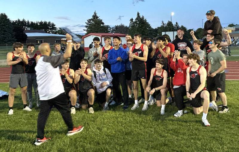Forreston track coach Tony Hardin brings the sectional plaque to his team after they won the 1A Oregon Sectional at Landers-Loomis Field on Friday, May 23, 2025.