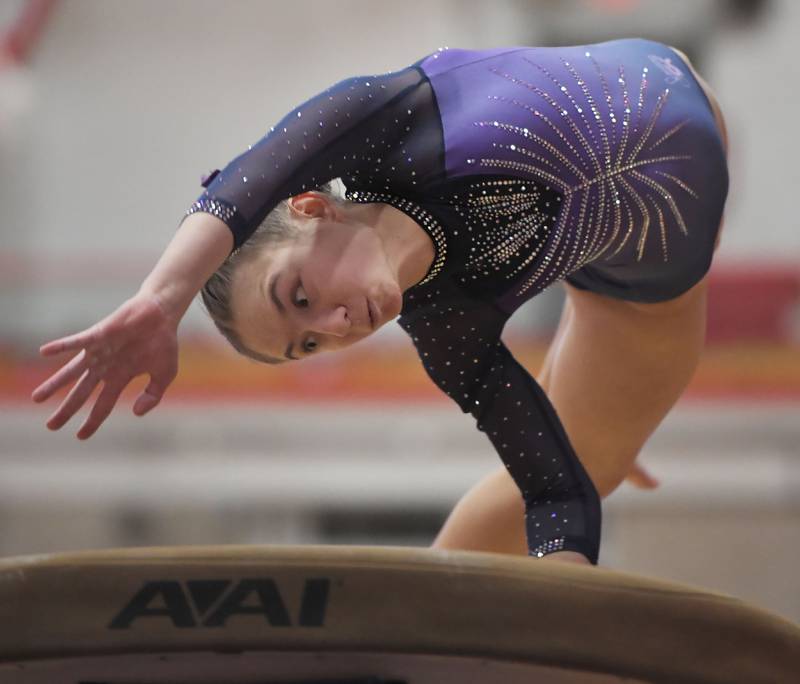 Downers Grove South’s Allison Palansky concentrates as she hits the vault at the Hinsdale Central girls gymnastics sectional meet in Hinsdale on Monday, Feb. 5, 2024.