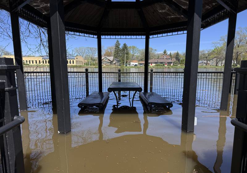 A gazebo and picnic table along the Fox River in West Dundee are flooded on Monday, Apr. 20, 2026.