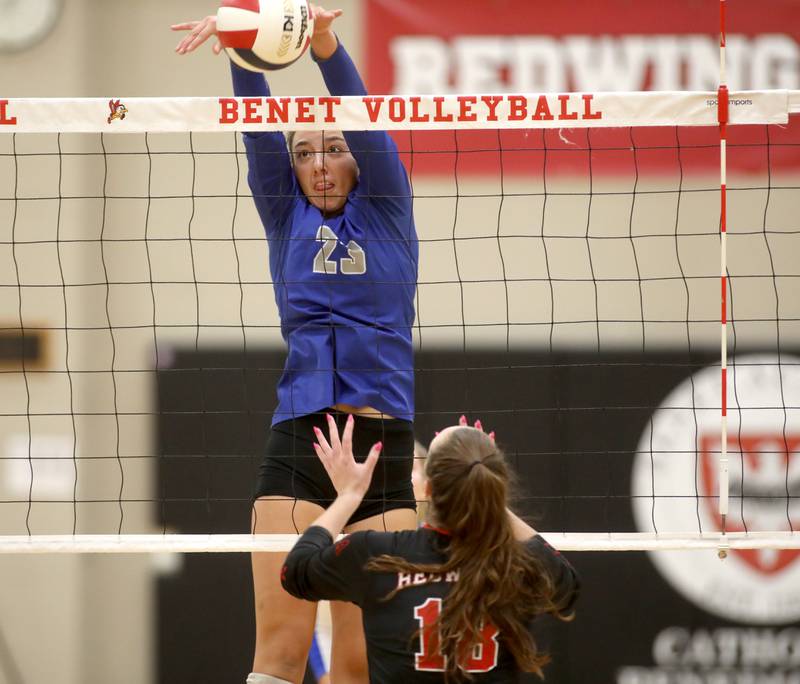 St. Charles North’s Haley Burgdorf goes up for a block during a game on Monday, Oct. 7, 2024 at Benet in Lisle.