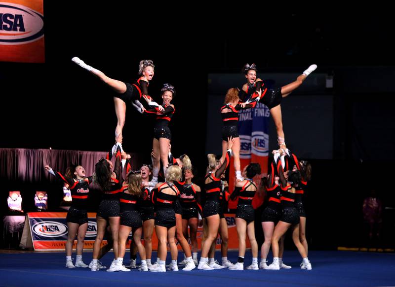 Members of the Minooka cheerleading team compete in the large team division of the IHSA State Finals on Saturday, Feb. 8, 2025 at Grossinger Motors Arena in Bloomington.