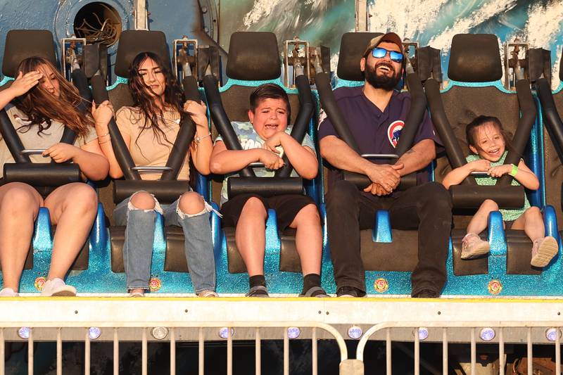 A family, except one, enjoys the Moby Dick ride at Lockport’s Canal Days on Friday, June 9, 2023.