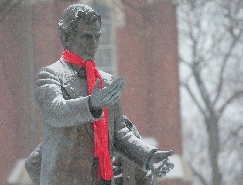 Light snow falls onto the Abraham Lincoln Statue on Wednesday, Feb. 12, 2025 at Washington Park in Ottawa. Wednesday marks the 215th birthday of the 16th President.
