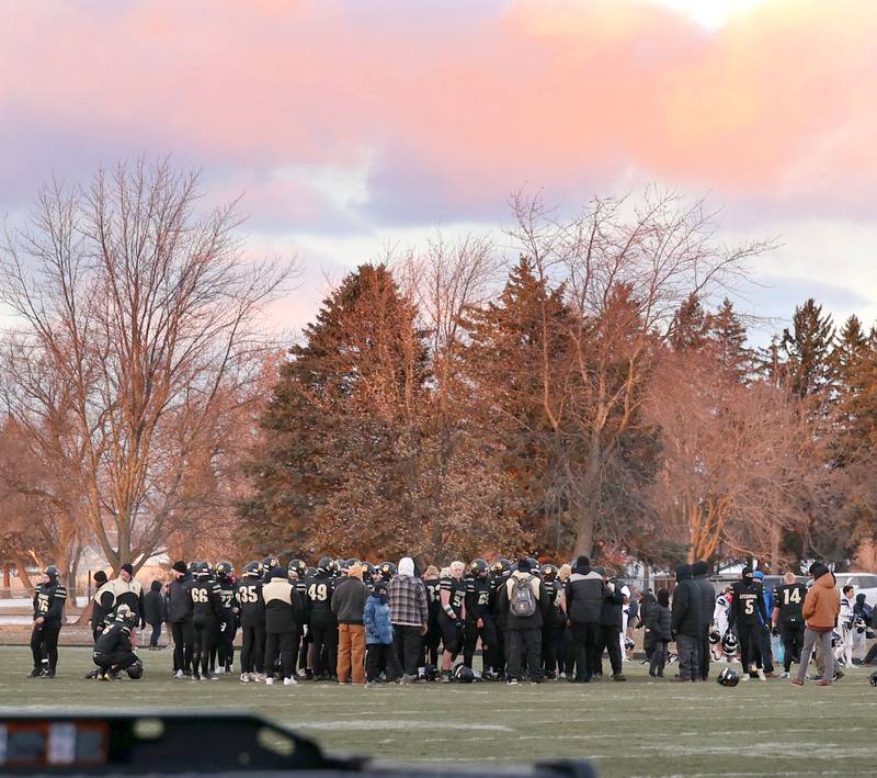 Sycamore players meet on the field one last time this year after their loss to Nazareth Saturday, Nov. 18, 2022, in the state semifinal game at Sycamore High School.