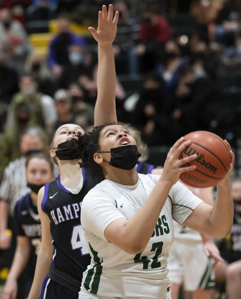 Crystal Lake South's Nicole Molgado shoots the ball as Hampshire's Chloe Van Horn defends during their game on Friday, January 14, 2022 at Crystal Lake South High School.