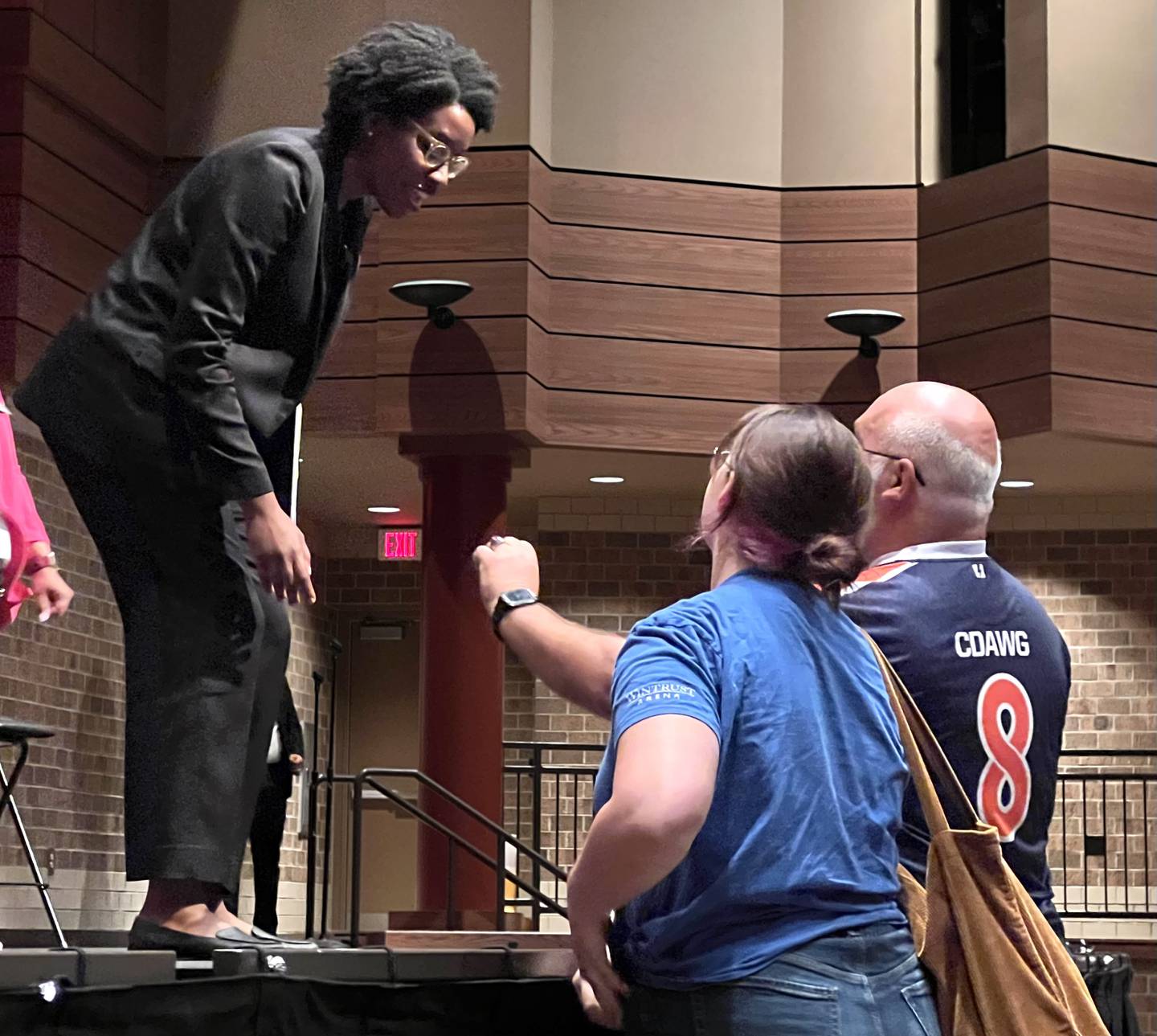 Congresswoman Lauren Underwood, D-Sandwich, introduced herself to Erika and John Cole, of DeKalb, after her Aug. 3, 2023 town hall meeting at DeKalb High School.