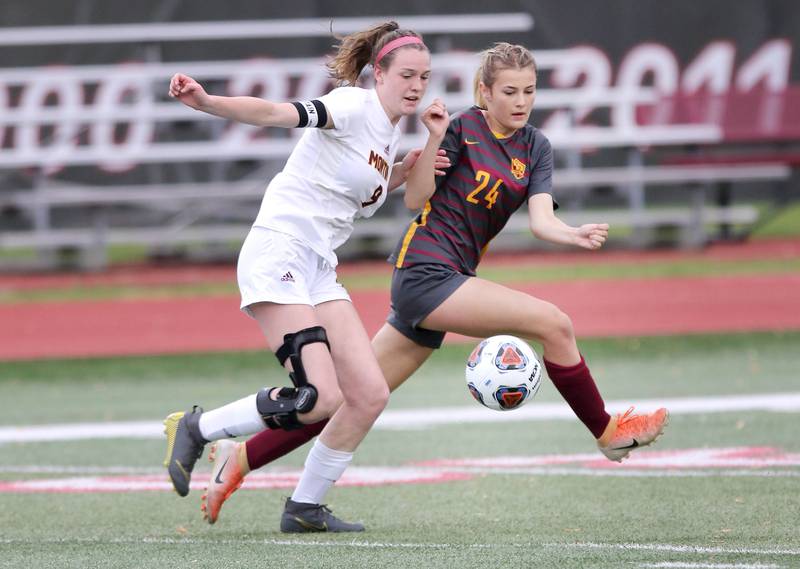 Montini's Maren Hoovel and Richmond-Burton's Ember Demers sprint for the ball Friday, May 27, 2022, during their IHSA Class 1A state semifinal game at North Central College in Naperville.