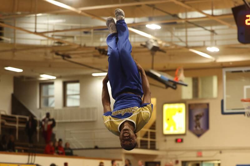 Joliet Central cheerleader performs during halftime against Joliet West.
