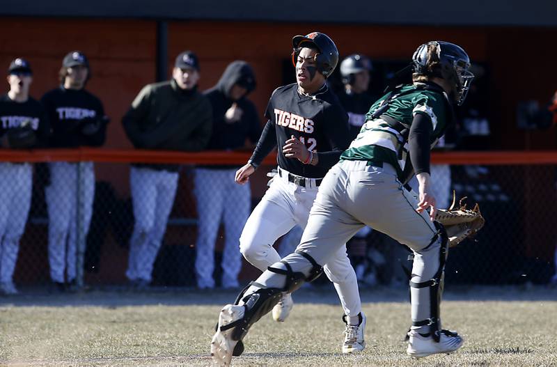 Crystal Lake Central's Jaden Obaldo runs to home as Boylan's Jack Kerno runs up the line after the baseball during a nonconference baseball game Wednesday, March 29, 2023, at Crystal Lake Central High School.