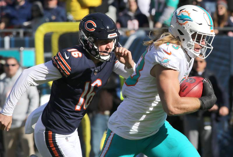 Miami Dolphins linebacker Andrew Van Ginkel is pursued by Chicago Bears punter Trenton Gill as he returns a blocked punt for a touchdown during their game Sunday, Nov. 6, 2022, at Soldier Field in Chicago.
