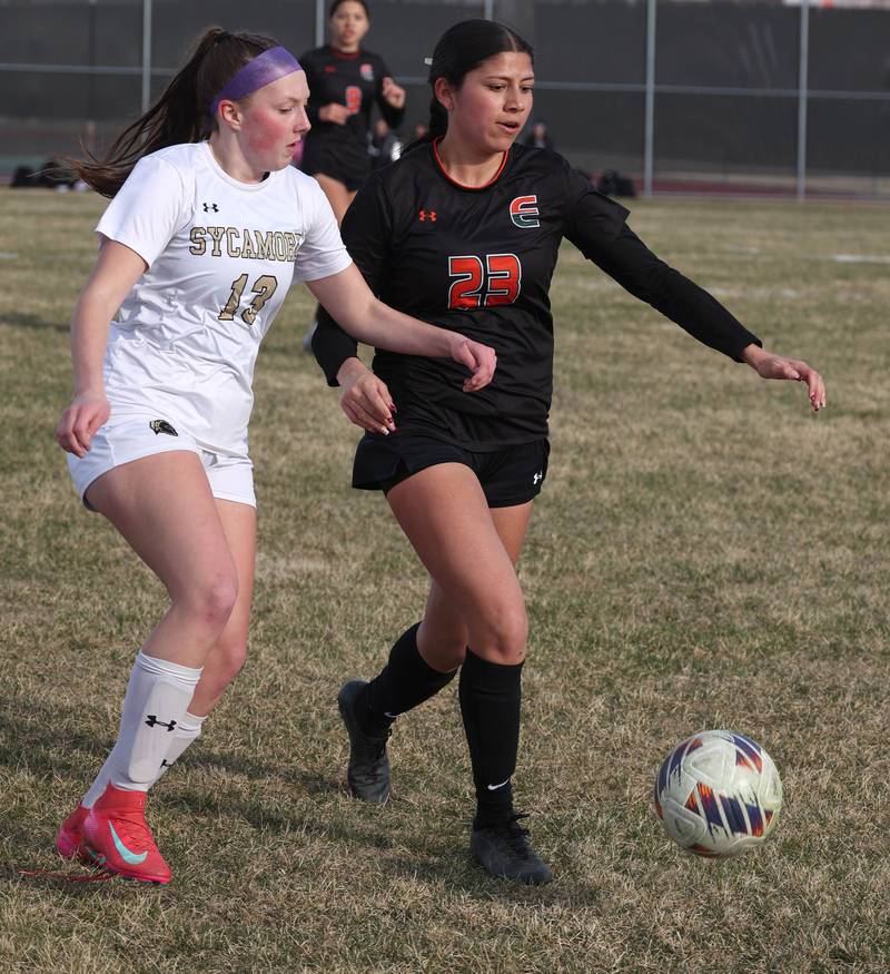 Sycamore's Kylie Runkle and Plainfield East's Annabelle Batinick chase down a loose ball during their game Tuesday, March 25, 2025, in the Barb Fest tournament at DeKalb High School.