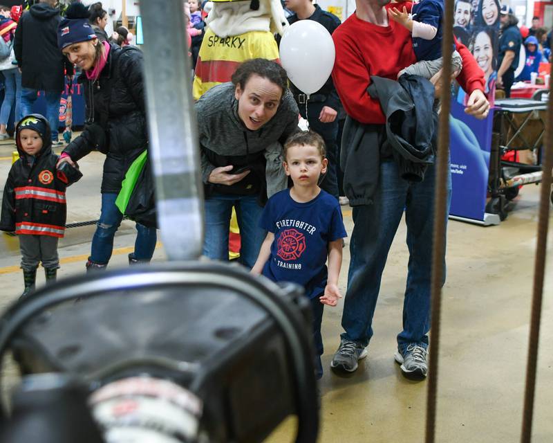 Michelle and her son Jonathan Grimestad, 4 years old, of Westmont watch the Westmont fire department demonstrate the Jaws of life on Saturday Oct. 14, 2023, during a Westmont fire department open house.