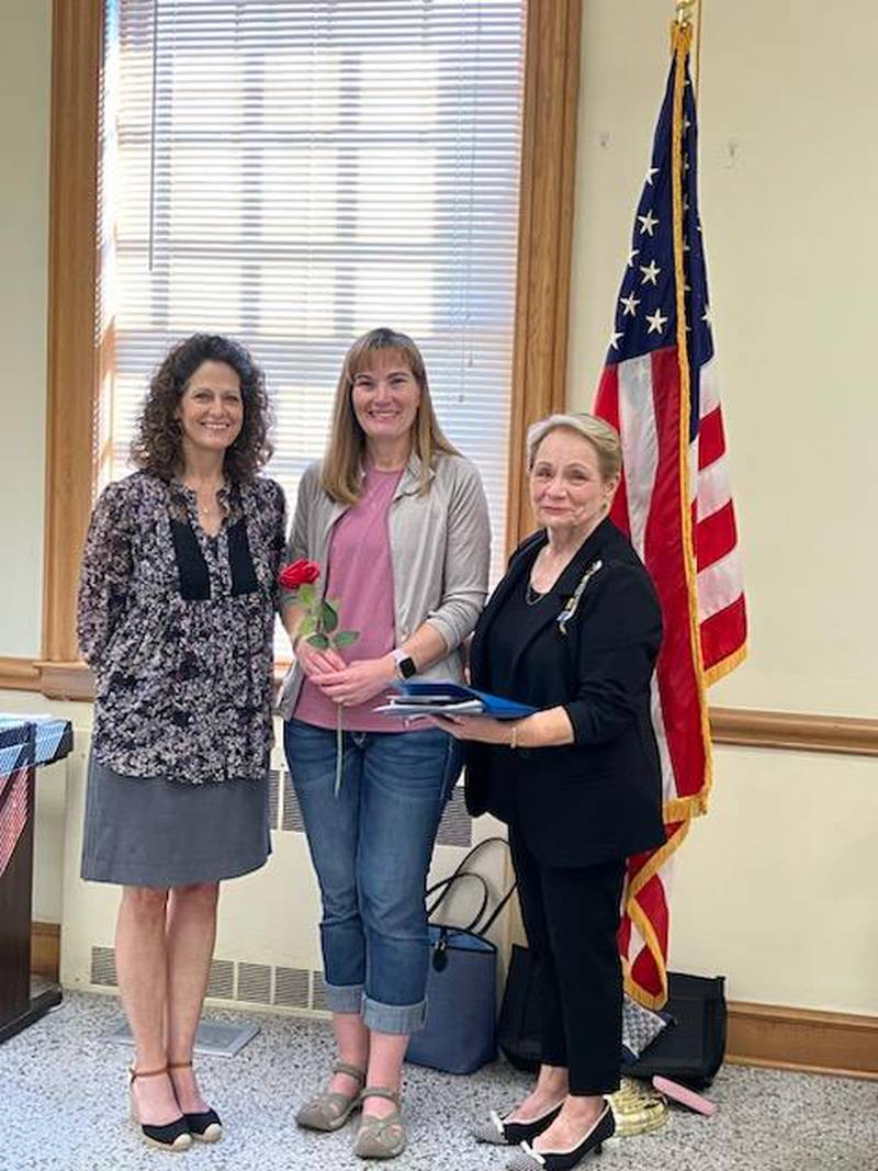 Carmela Blanco, registrar, and Christina Anderson, meet with Nancy Gartner, regent of Princeton-Illinois DAR.