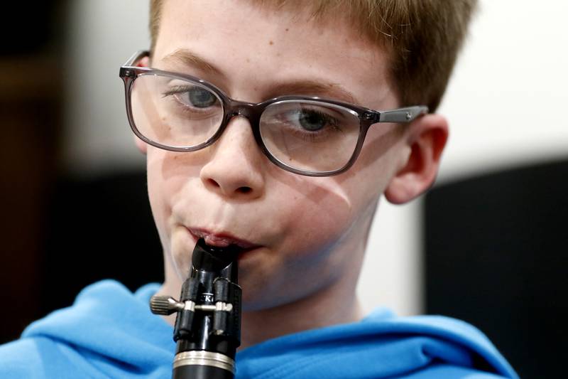 Ethan White, 12, of Crystal Lake, plays the clarinet during a lesson Tuesday, Feb. 22, 2022, at Encore Music Academy, 87 N. Williams St., in Crystal Lake. The academy moved into its new location over Thanksgiving week last year. The larger location allows for the expansion of its private student instruction and also has a large space suitable for performing.