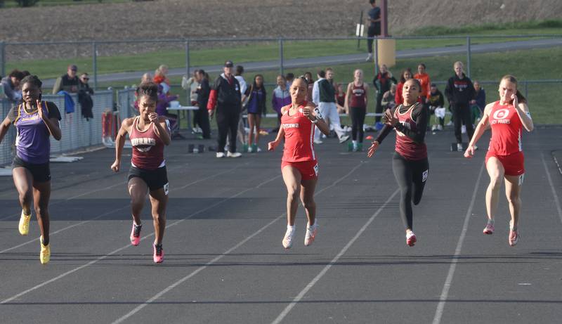 (From left) Mendota's Jeniah Francis, Morris's Dynasty Brooks, Ottawa's Trinity Casas, Morris's Cyncere Rucker, and Ottawa's Savannah Markey compete in the 100 meter dash during the Class 2A Sectional track meet on Wednesday, May 13, 2026 in the Jeff Prusator Athletic Complex at Mendota High School.