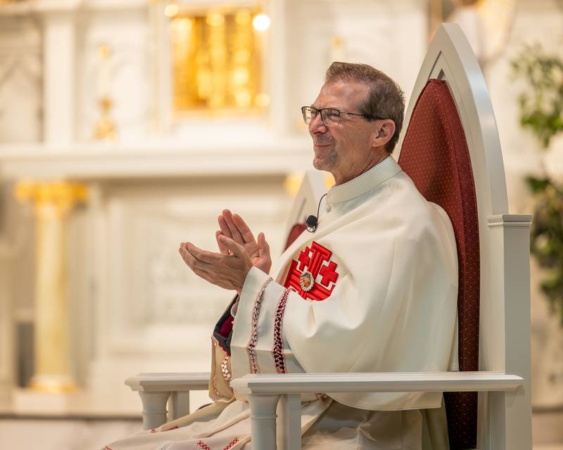 Monsignor Mark Merdian applauds graduates at the 2026 Marquette Academy Graduation Ceremony on May 24, 2026 at St. Columba Church in Ottawa.