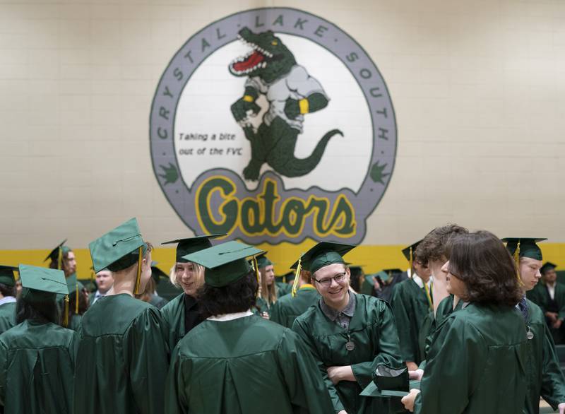 Graduates gather in the gym before a graduation ceremony for the class of 2022 on Saturday, May 14, 2022, at Crystal Lake South High School in Crystal Lake.