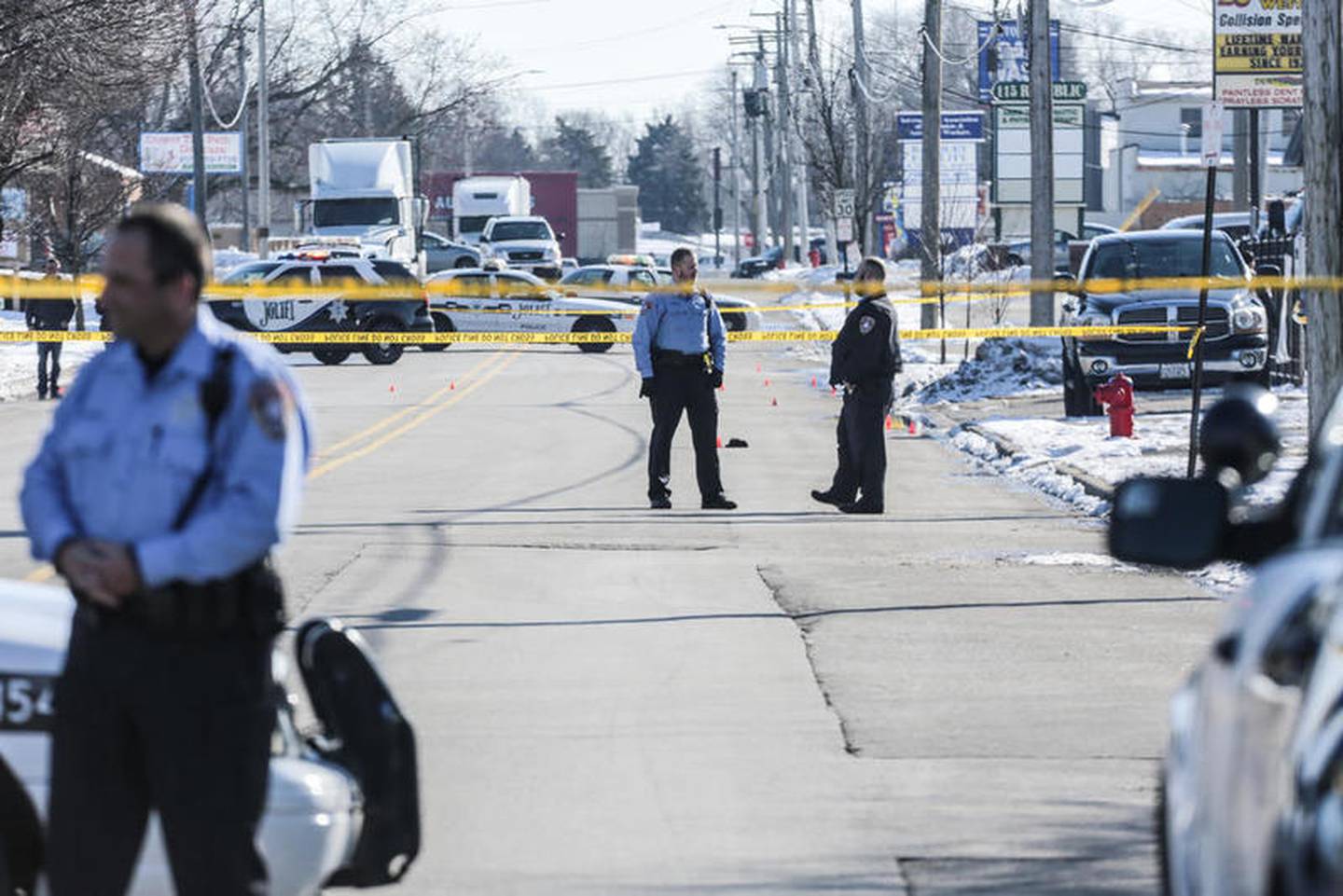 Police secure the scene of a shooting Friday along Republic Avenue in Joliet.