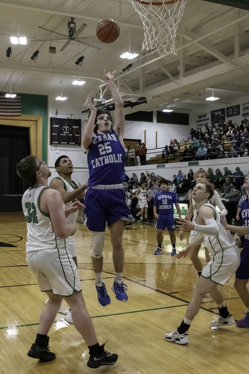 Newman's Kenny Boesen (25) shoots in the lane as Rock Falls defenders look on during their nonconference game Wednesday, Feb. 15, 2023 at Tabor Gym.