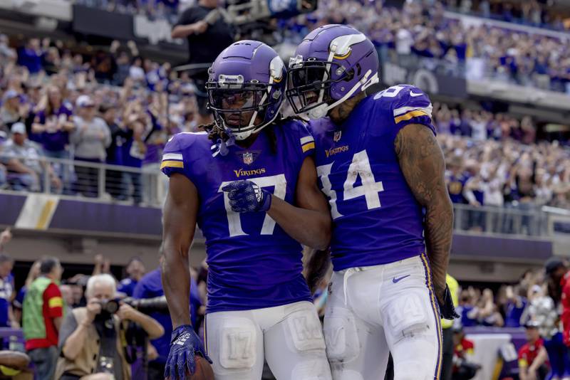 Minnesota Vikings tight end Irv Smith Jr. (84) celebrates with wide receiver K.J. Osborn (17) after Osborn scored a touchdown during the second half of an NFL football game against the Detroit Lions, Sunday, Sept. 25, 2022 in Minneapolis. (AP Photo/Stacy Bengs)