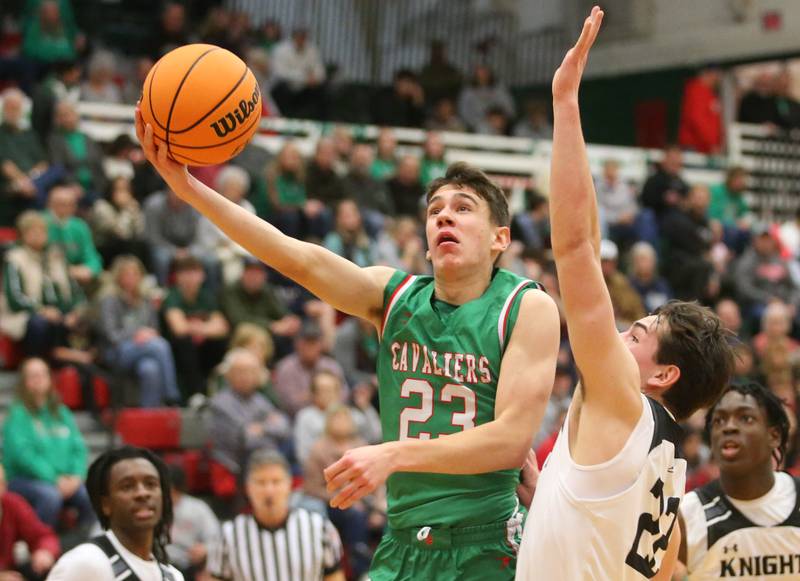 L-P's Nick Olivero drives to the hoop while being guarded by Kaneland's Connor Kimme on Friday, Jan. 31, 2025 in Sellett Gymnasium at L-P High School.