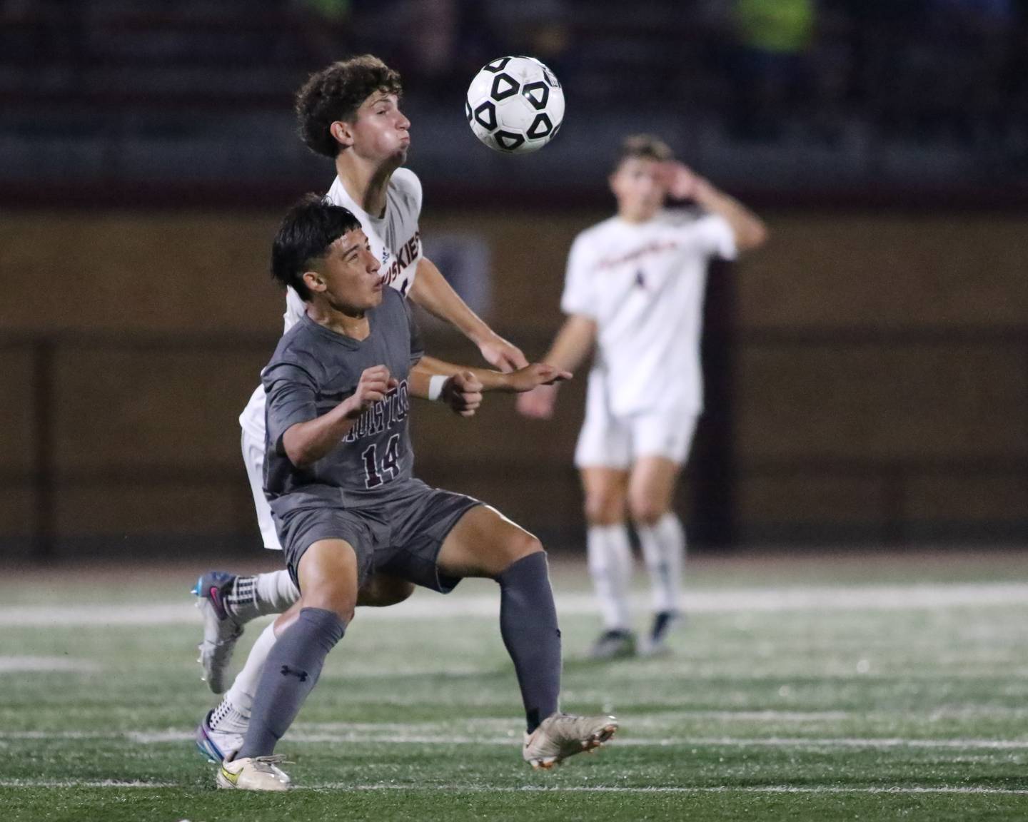 Morton's Caleb Mendoza (14) battles Naperville North's Niko Ladas (14) for the ball during soccer match between Naperville North at Morton.  Sept 21, 2023.