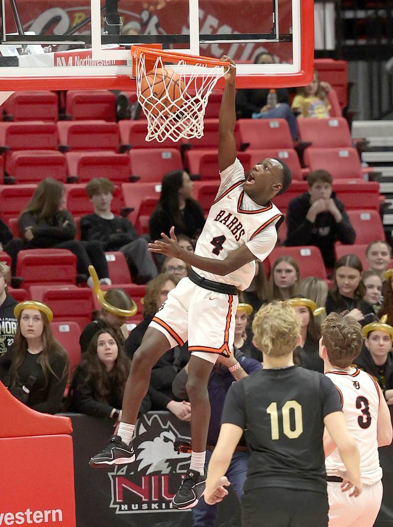 DeKalb’s Marquise Bolden gets by the Sycamore defense for a dunk Friday, Jan. 26, 2024, during the FNBO Challenge in the Convocation Center at Northern Illinois University.
