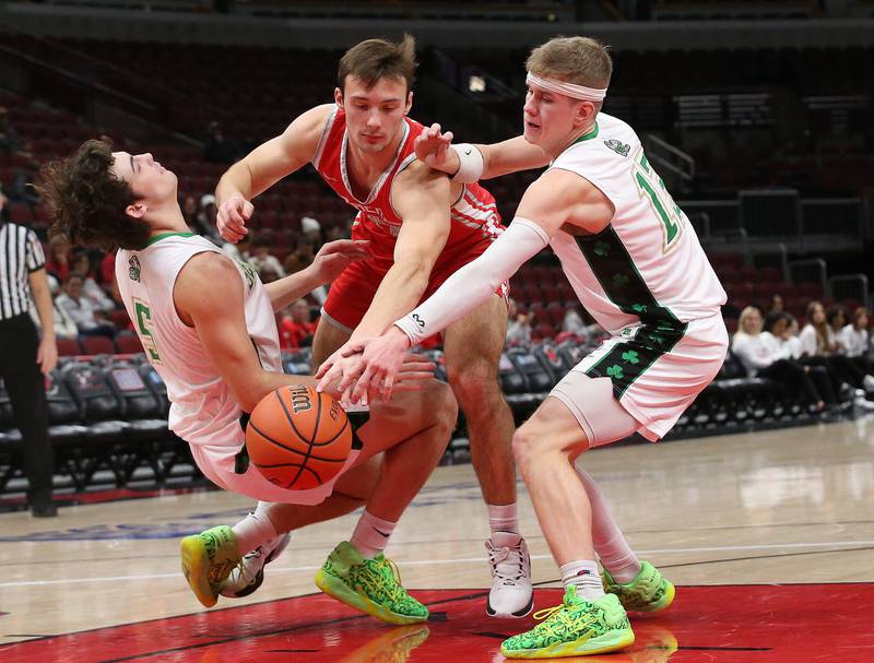 Streator's Christian Benning draws a foul on Seneca's Kysen Klinker as teammate Paxton Giertz reaches to grab the ball during a game on Tuesday, Dec. 21, 2023 at the United Center in Chicago.