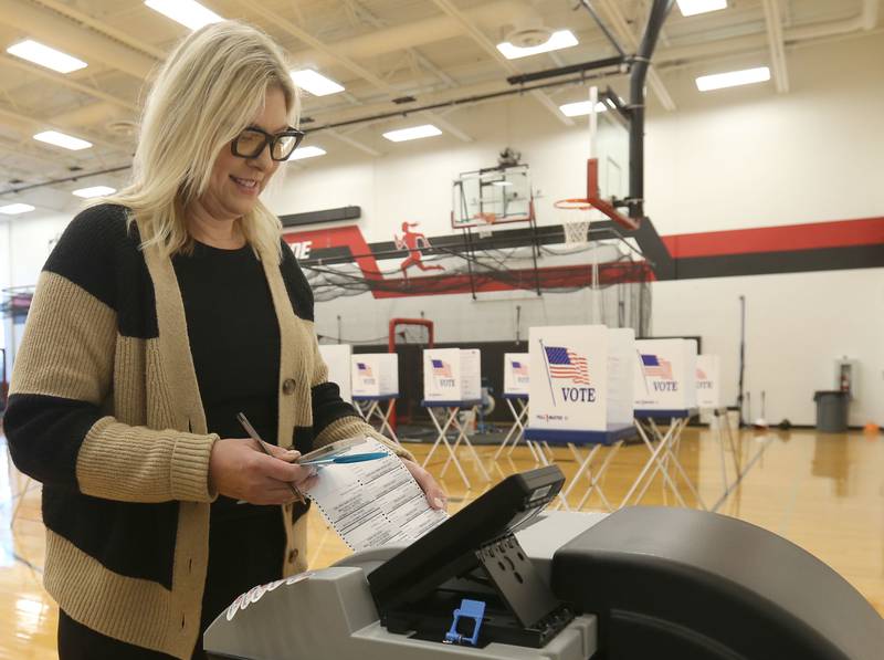 Julie DeAngelo casts her ballot on Tuesday, April 1, 2025 at Hall High School in Spring Valley. The City of Spring Valley has a mayor race between Debra L. Perino and incumbent Melanie Malooley Thompson.