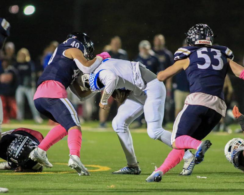 St. Francis's Alessio Milivojevic (11) is sacked by IC Catholic Prep's Dominik Hulak (40) during varsity football game between St Francis at IC Catholic Prep.  Oct 21, 2022.