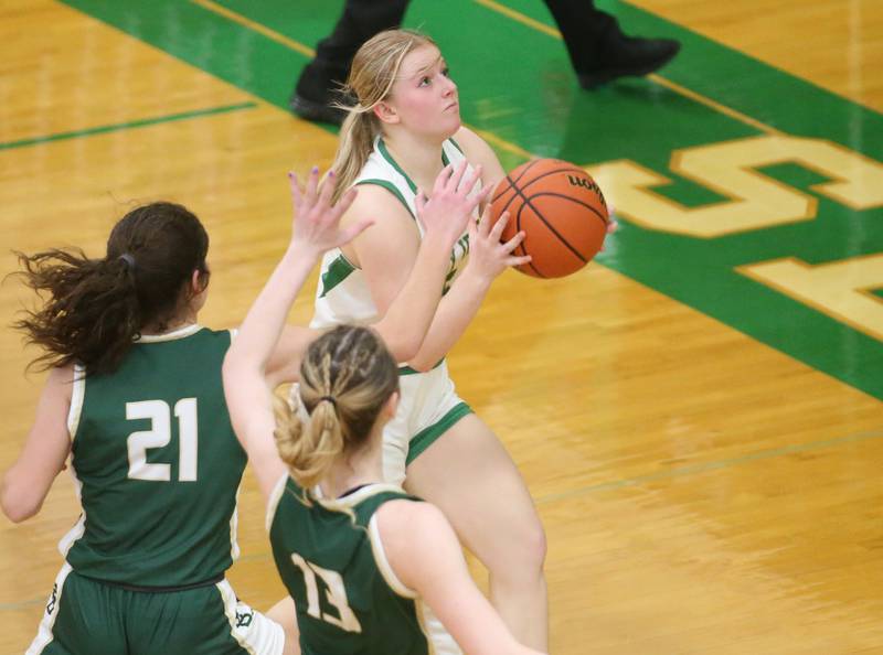 Seneca's Lauryn Barla eyes the hoop while making her way in the lane as St. Bede's Lily Bosnich and teammate Ashlyn Ehm defend on Monday, Jan. 29, 2024 at Seneca High School.