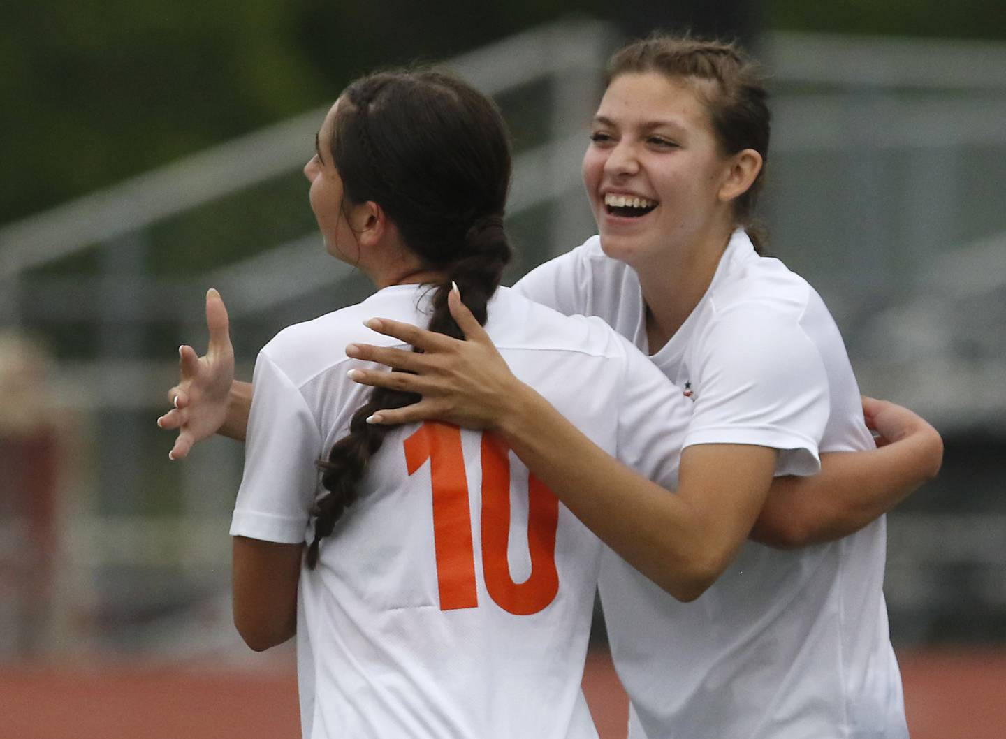Crystal Lake Central's Addison Schaffer is hugged by her teammates, Kira Stavropoulos, after Crystal Lake Central defeated St. Viator  in the IHSA Class 2A Deerfield Sectional championship girls soccer match on Friday, May 30, 2025, at Deerfield High School.
