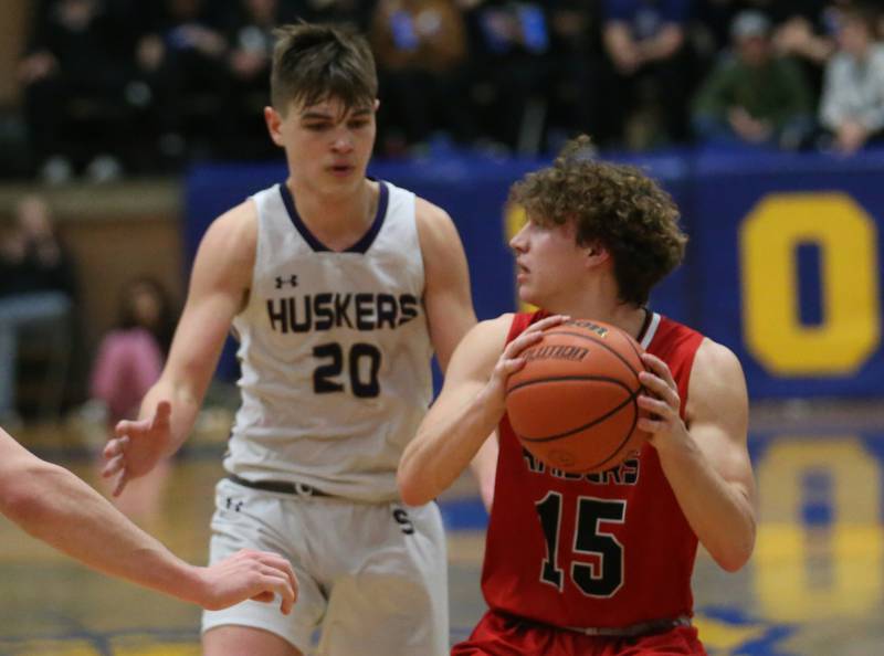 Earlville's Trenton Fruit looks to pass the ball around Serena's Beau Raikes during the Little Ten Conference Championship on Friday, Feb. 2, 2024 at Somonauk High School.