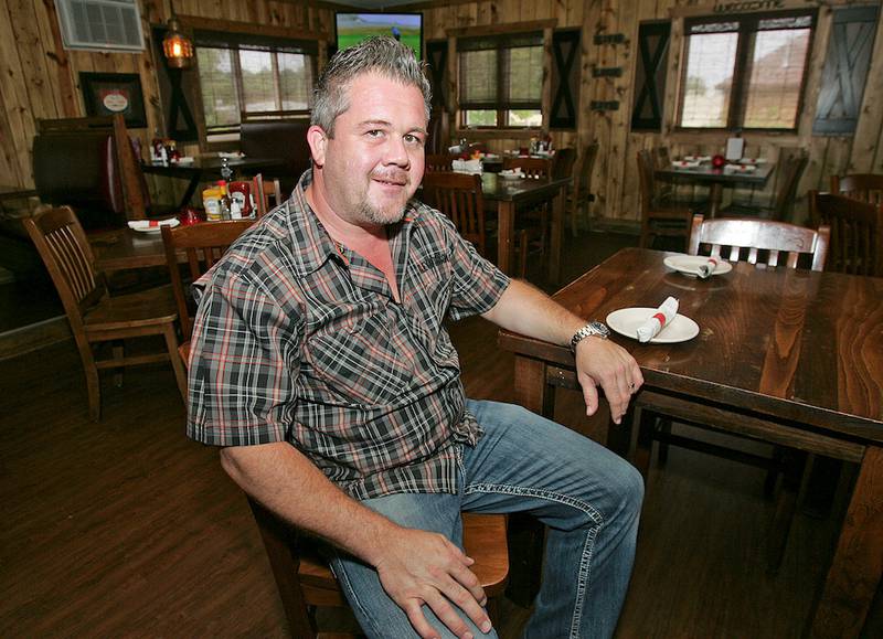 Niko Kanakaris in the dining room of Niko's Red Mill Tavern in Woodstock. Kanakaris opened his first restaurant at age 23, and has invested in several restaurants over the years. He plans  to open a new one in Marengo. The Huntley resident comes from a family of restaurateurs.