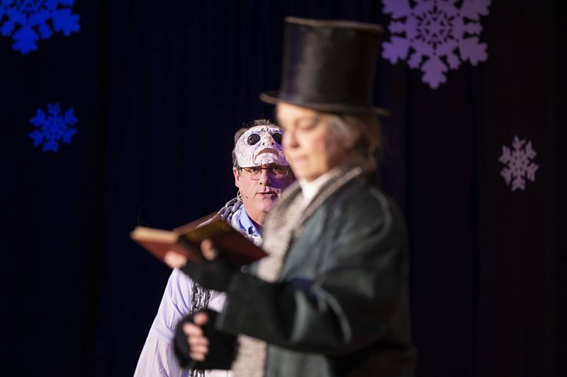 Actor Morgan McConnell convinces Connie Augsburger to put aside the Dickens’ classic for a look at holiday stories told around the world.